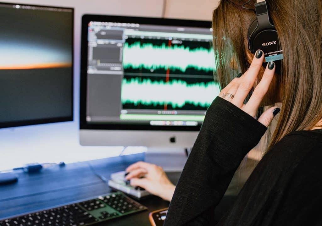 picture of woman editing a podcast