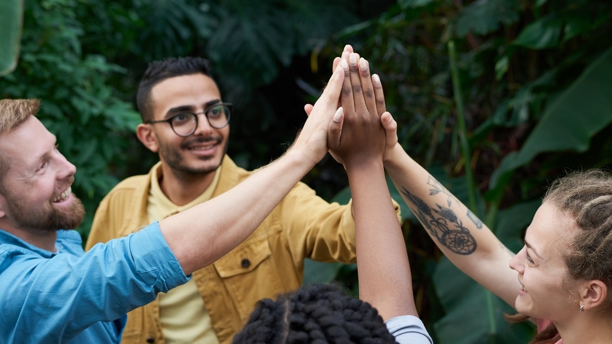 group of people giving a high five