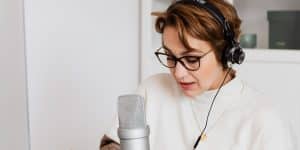 woman on podcast - how to score big guest interviews