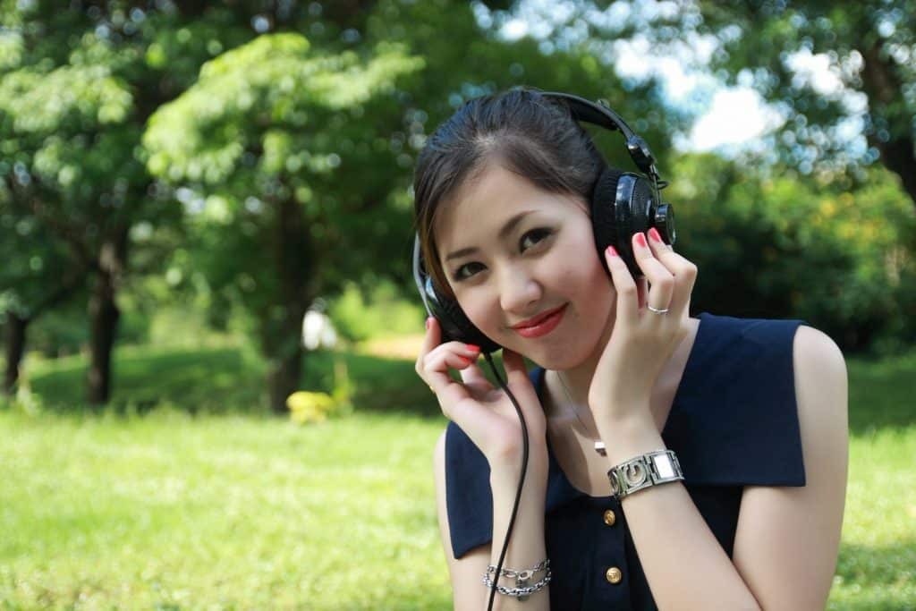 girl listening to a podcast on headphones