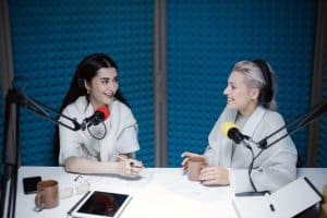 two women on a podcast