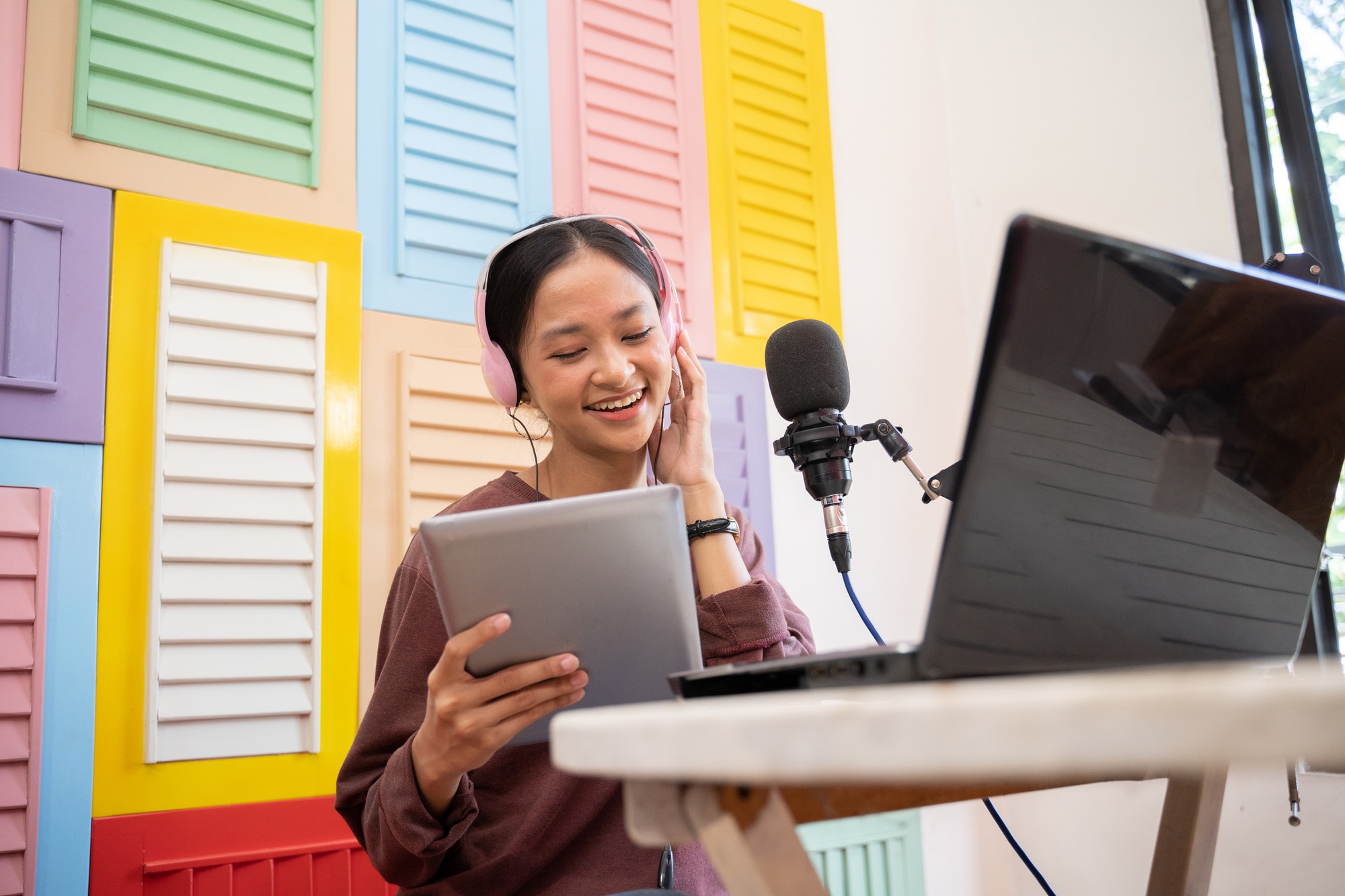 woman reading an ipad for her podcast